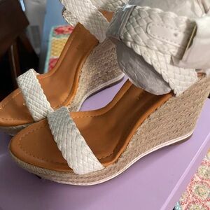 Am selling this brand new never wore heel wedges perfect for all occasions